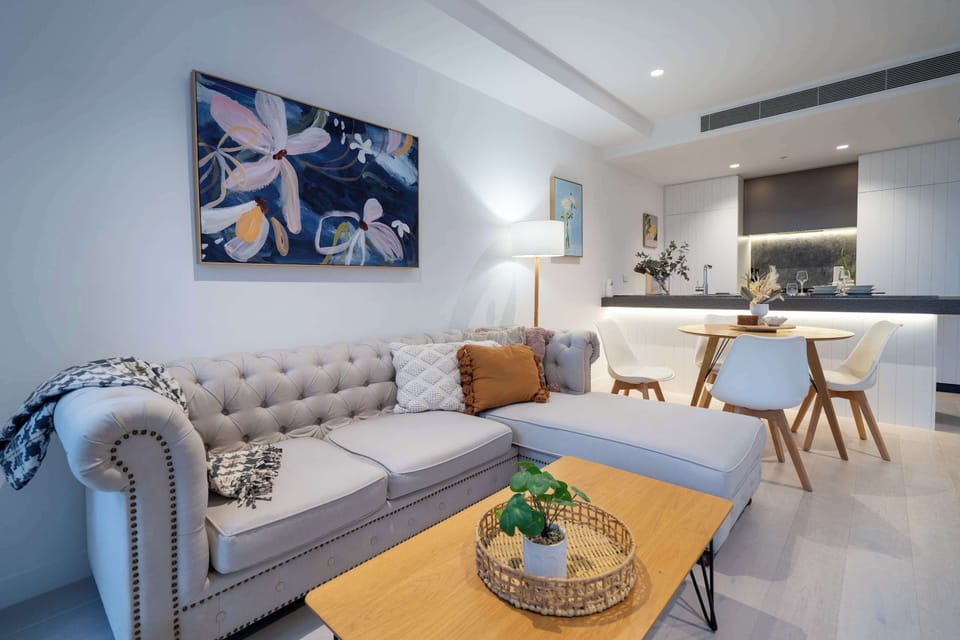 Open plan living area with plushy sofa