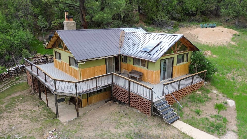 Aerial view of your off-grid haven--hosts live upstairs and guests stay downstairs.