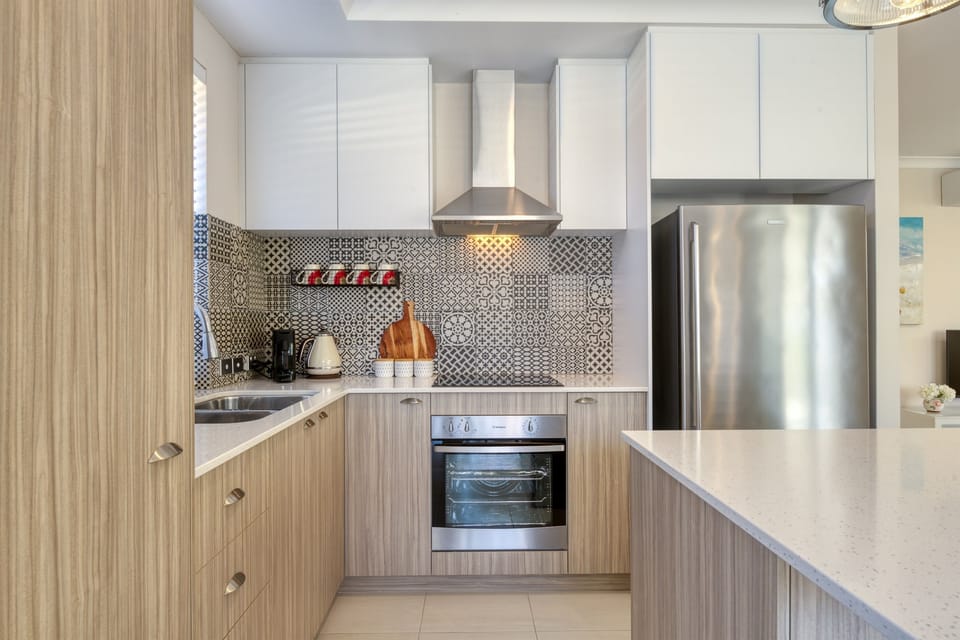 Modern kitchen with sleek finishes and stylish backsplash