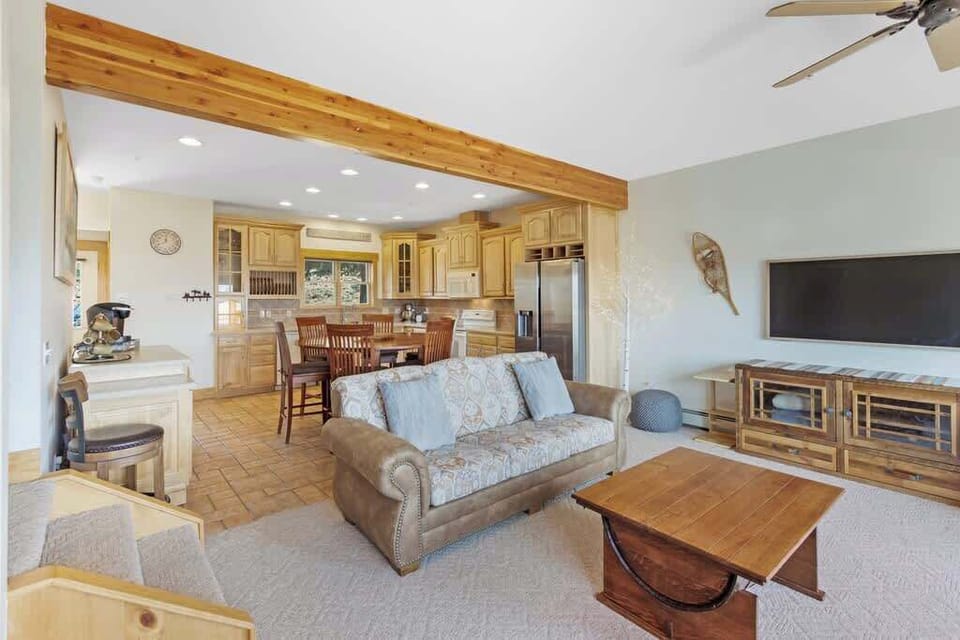 Living room opens up into the dining space and kitchen.