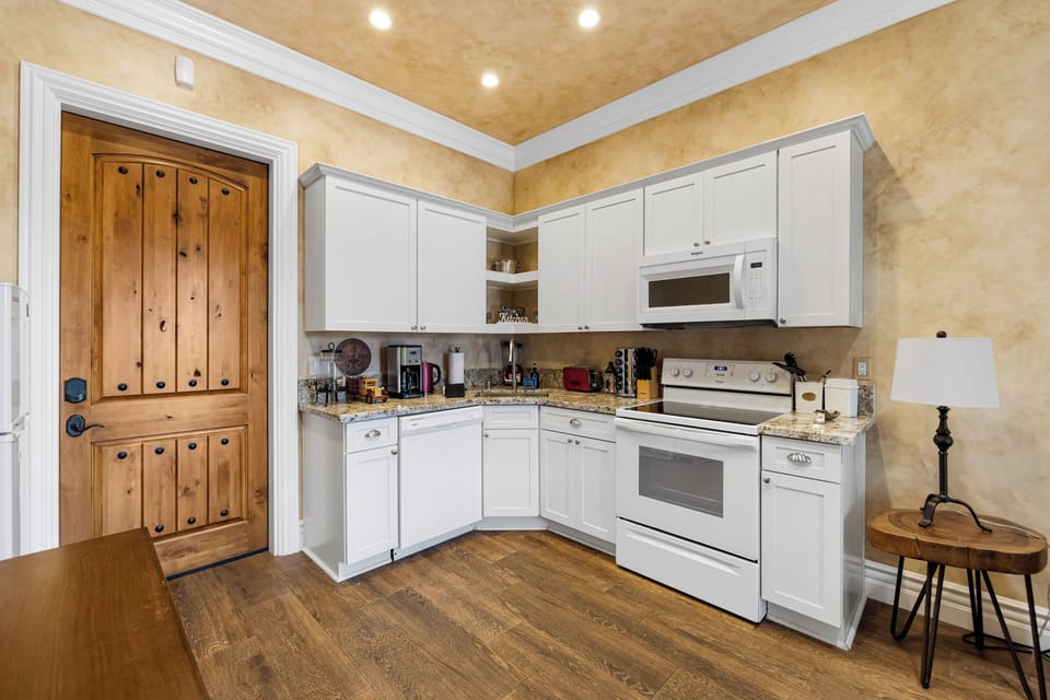 A compact kitchenette offers everything needed for easy meals.