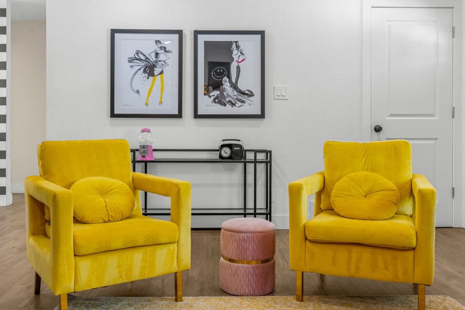 A cozy living room with large smart TV- the fireplace is not operational