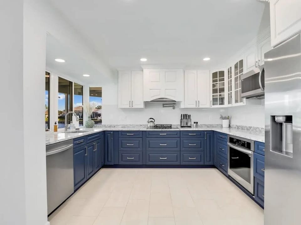 The unit features a clean, fully equipped kitchen with ample storage. Perfect for preparing meals while enjoying beautiful lake views.