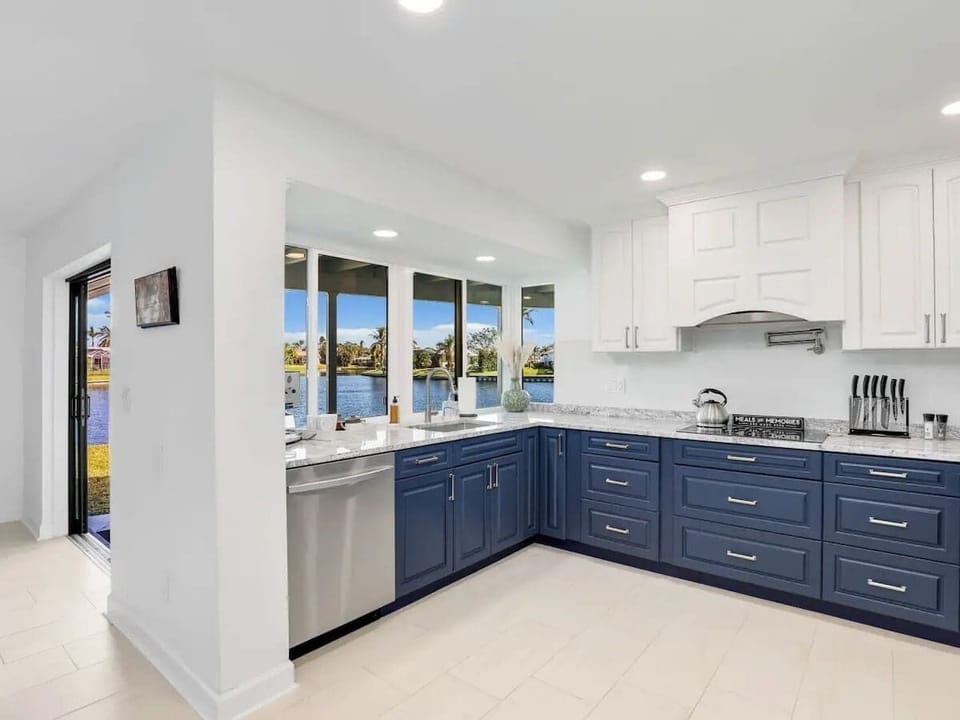 The unit features a clean, fully equipped kitchen with ample storage. Perfect for preparing meals while enjoying beautiful lake views.