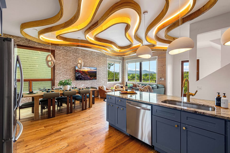 Panoramic views + perfect pours from the island to the lounge—entertain in style! 🌄🍷🛋️