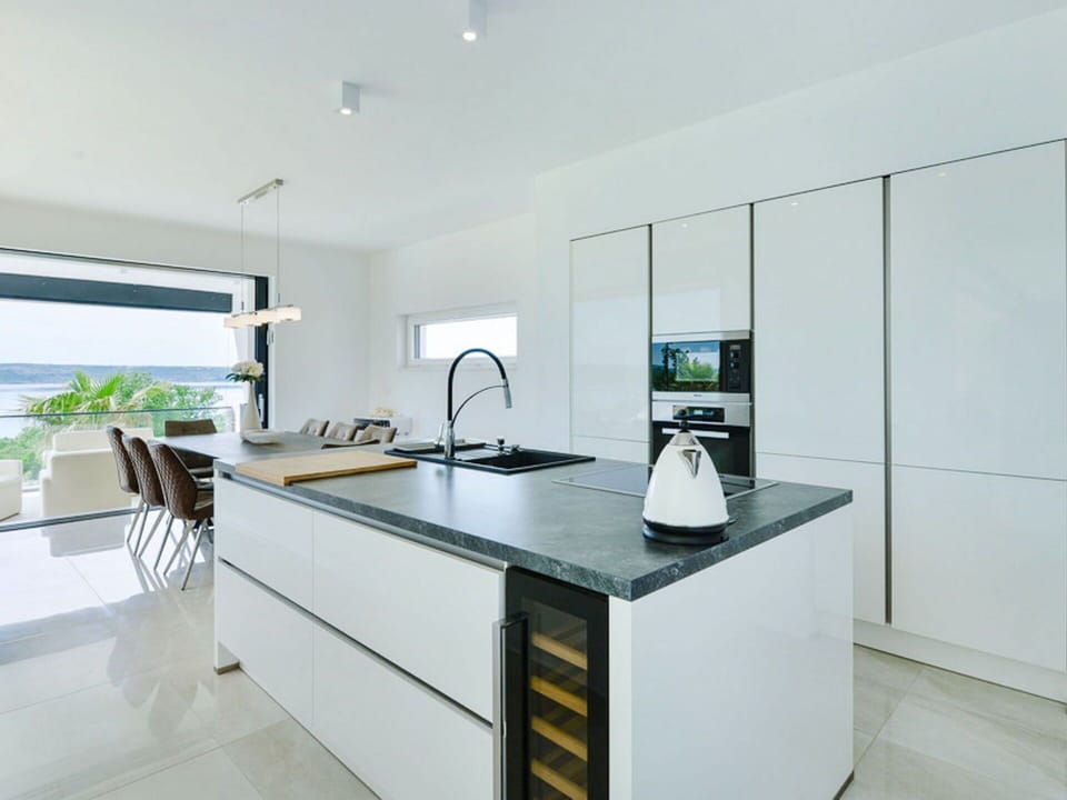 Kitchen, Countertop, Interior Design, Flooring, Floor, Cabinetry, Furniture, Kitchen Appliance, Home Appliance, Ceiling