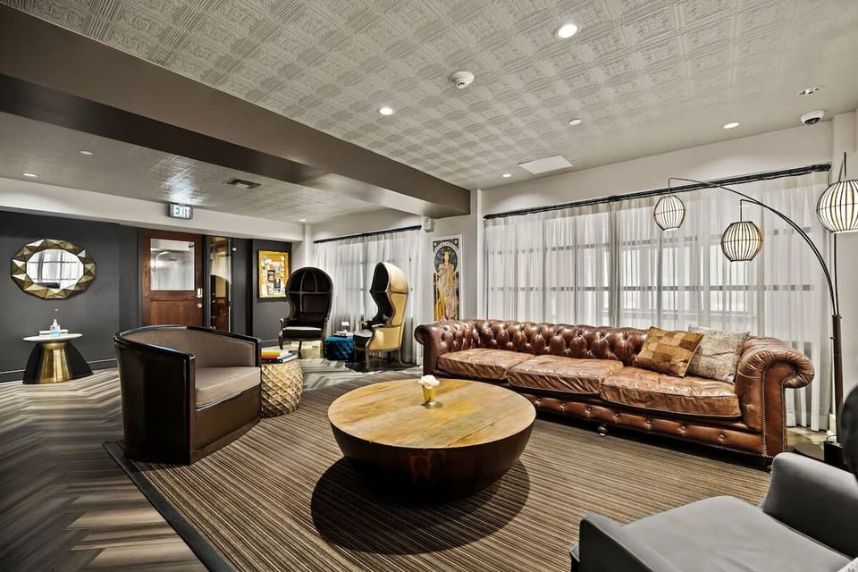 Unwind on plush leather seating under warm, modern lighting.