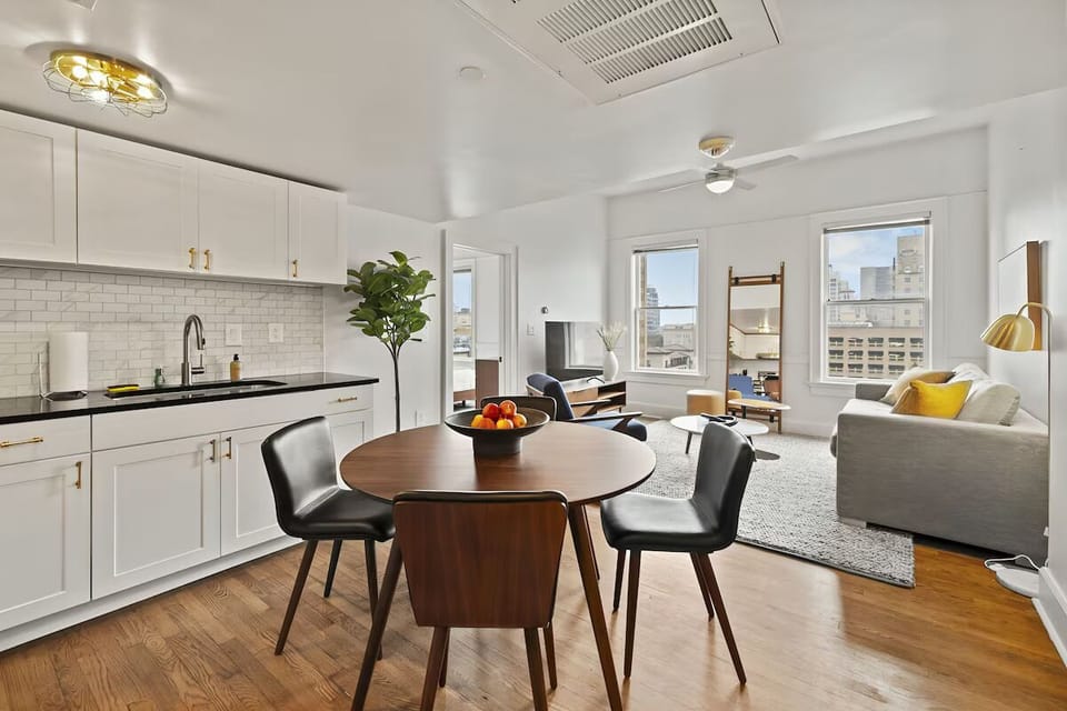 Gather for meals in a sunlit open-plan lounge.