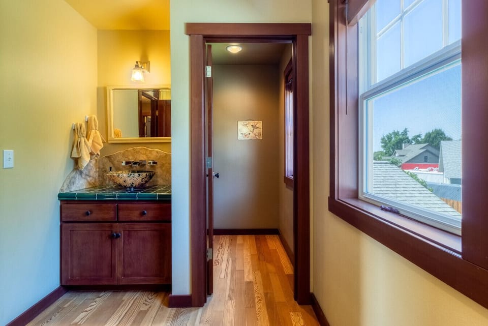 Common full bath upstairs with waterfall sink