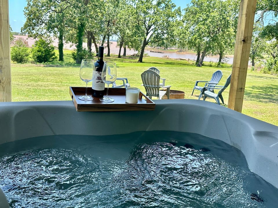 Relax in the hot tub with a glass of wine and the breathtaking view of Texoma Lake