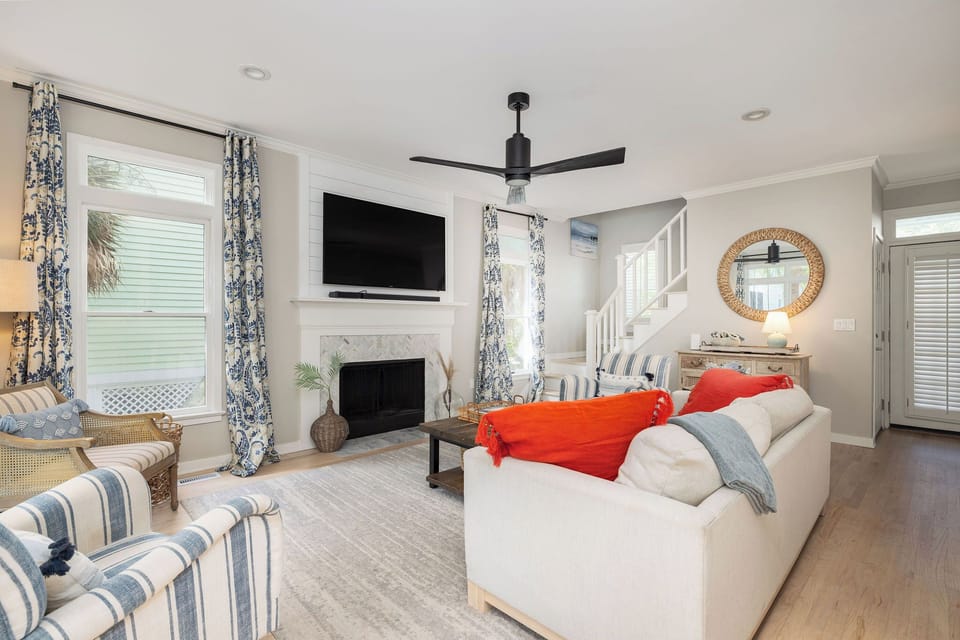 Inviting open-concept living area featuring ocean-inspired accents