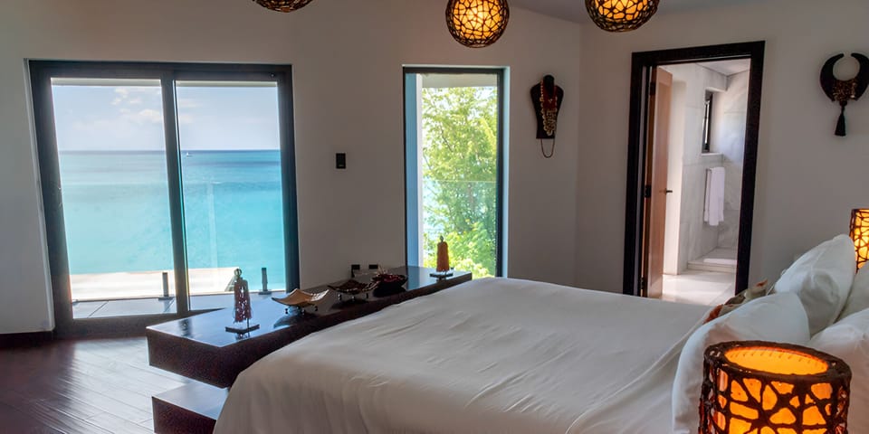 Relax in crisp linens while the sea breeze drifts in.