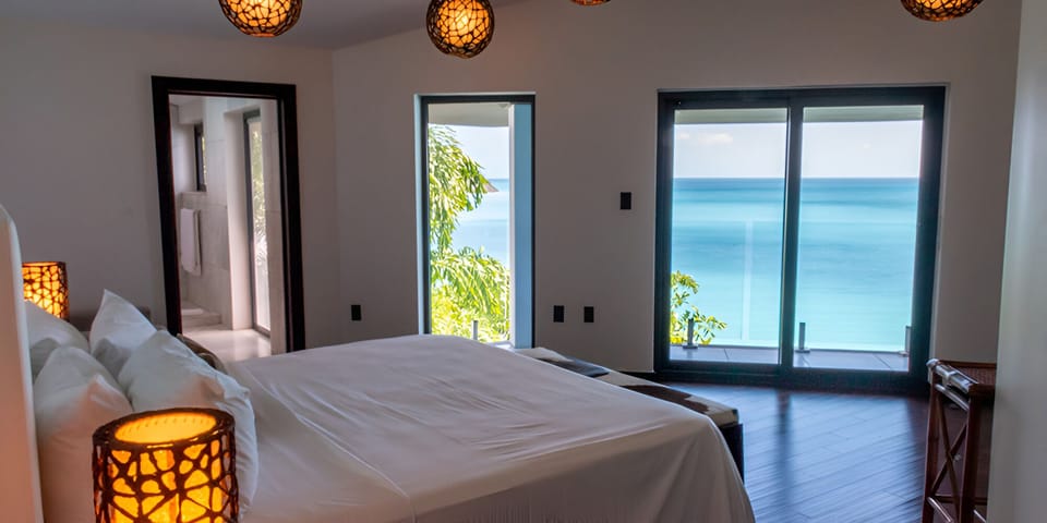 Unwind with tranquil horizon views framed by floor-to-ceiling glass.