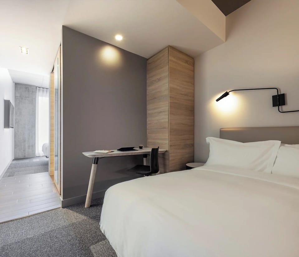 Settle in smoothly with a restful bed and handy work desk.