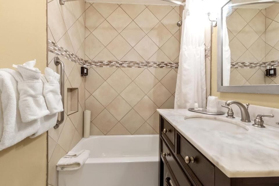 Refresh with a sparkling tub shower and plush towels.