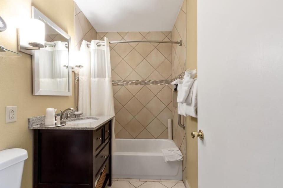 Step into a bright bath with ample counter space.
