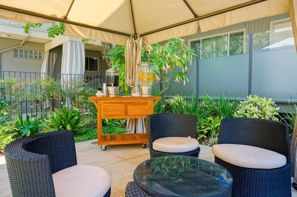 Sip something refreshing under the canopy in a garden nook.