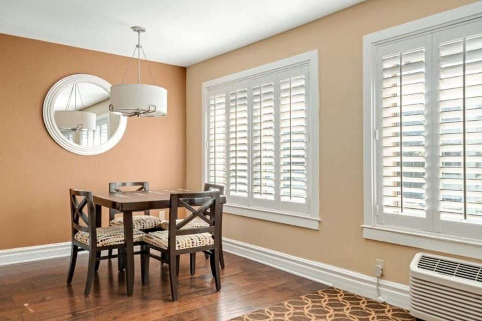 Settle in with a spacious desk beside sunny dining nook.