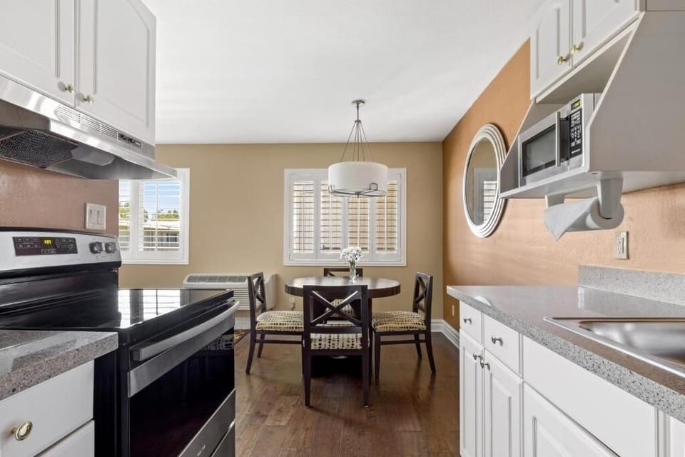Cook with ease in a bright kitchen beside sunny dining.