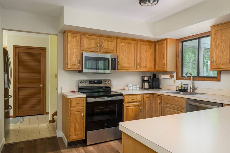 Full kitchen with stove, microwave, and everything needed to cook