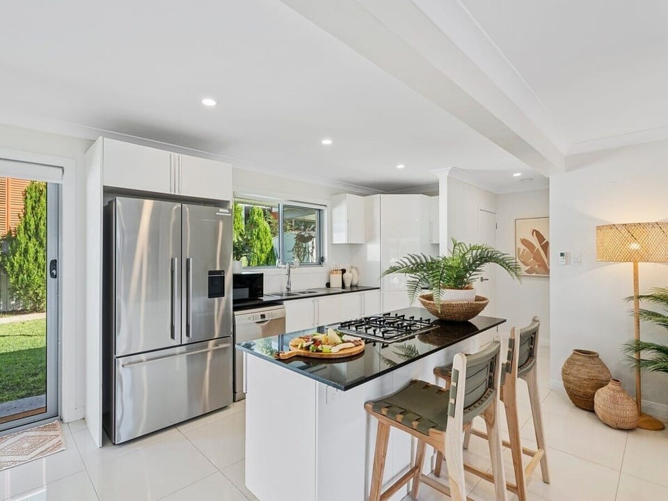 Kitchen with stainless appliances, gas cooktop, dishwasher and Nespresso.