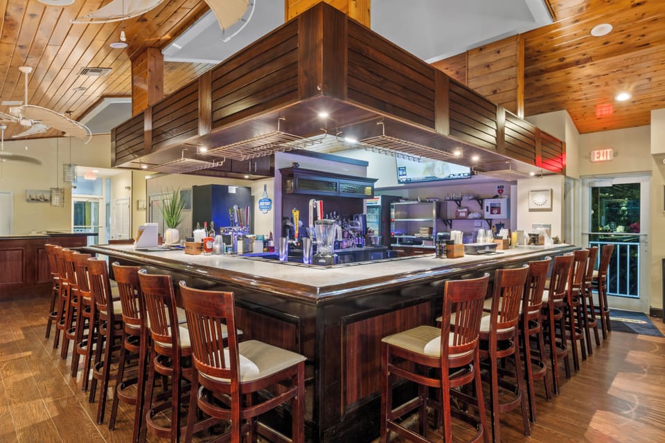 Sip handcrafted cocktails at the warm, lively island bar.