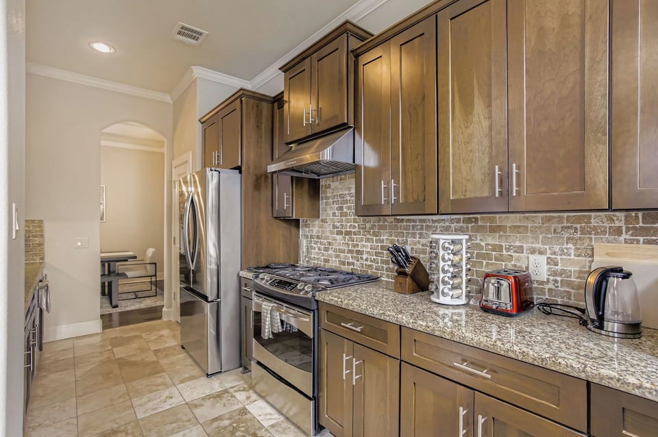 Modern kitchen with sleek finishes, stainless steel appliances