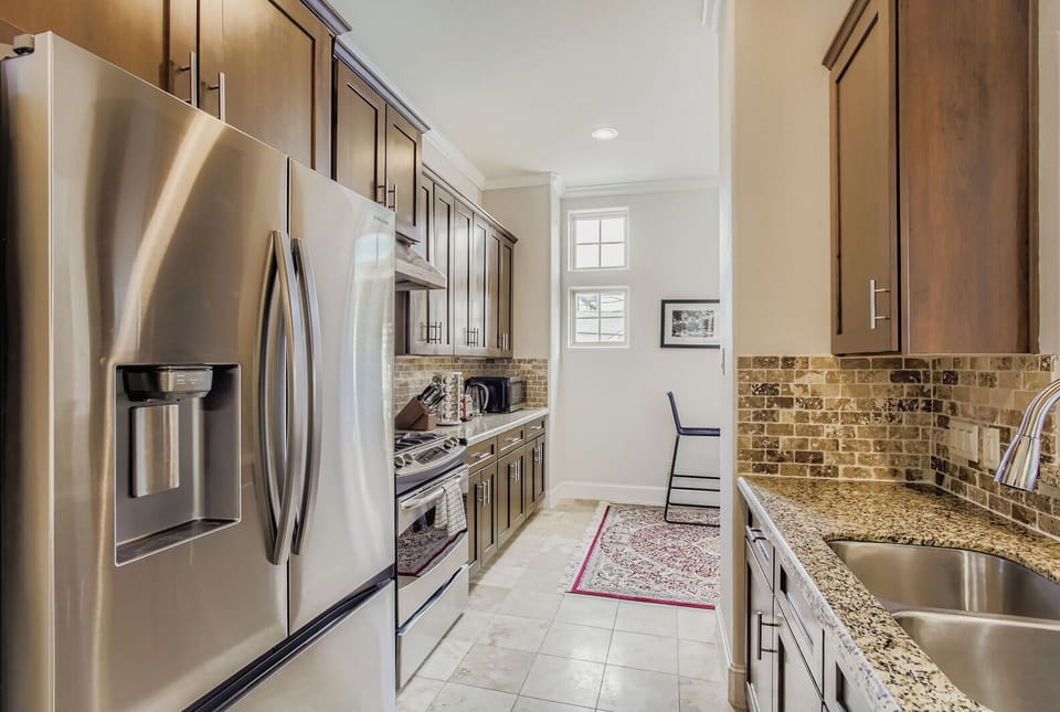 Modern kitchen with sleek finishes, stainless steel appliances