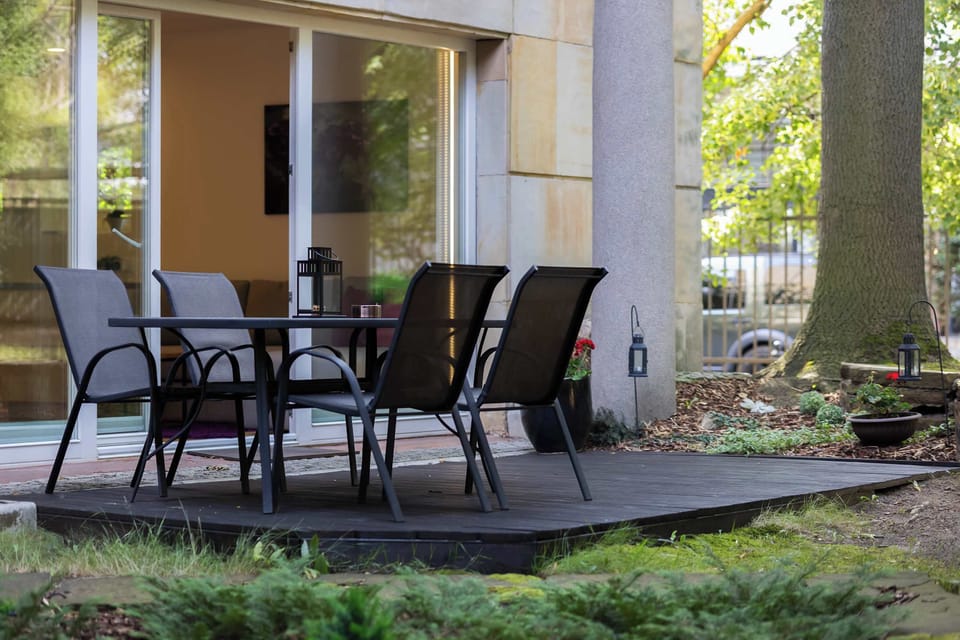 Garden terrace with a comfortable table and chairs, perfect for morning coffee or evening relaxation.