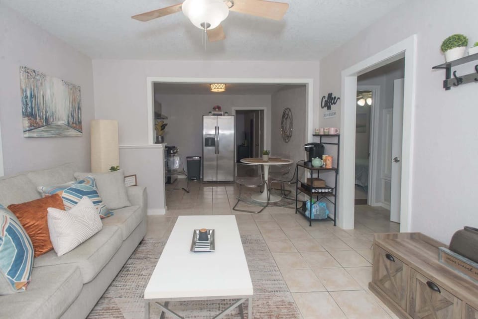 Step into an open living space designed for coffee, comfort, and connection