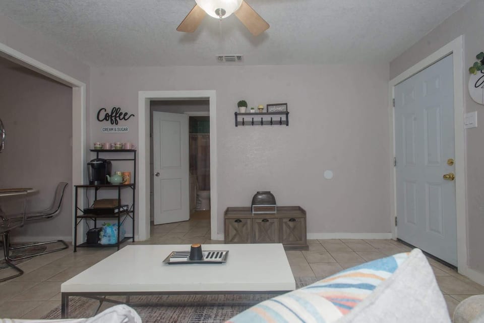 Step into an open living space designed for coffee, comfort, and connection