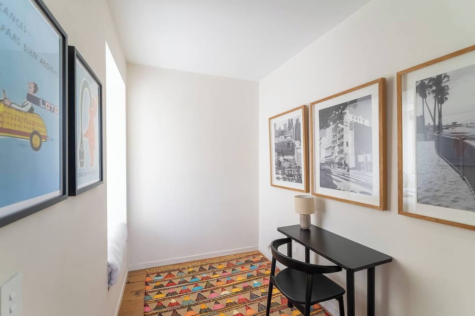 A dedicated desk space for focused work, and the third sleeping zone features a single bed tucked into the window nook just behind, ideal for quick naps.