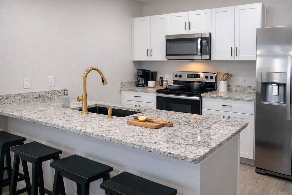 Our galley kitchen has plenty of space for cooking and chatting with your loved ones!
