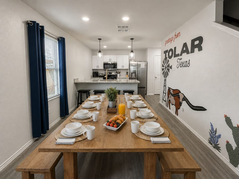 Spacious dining area with farmhouse table and stylish open kitchen