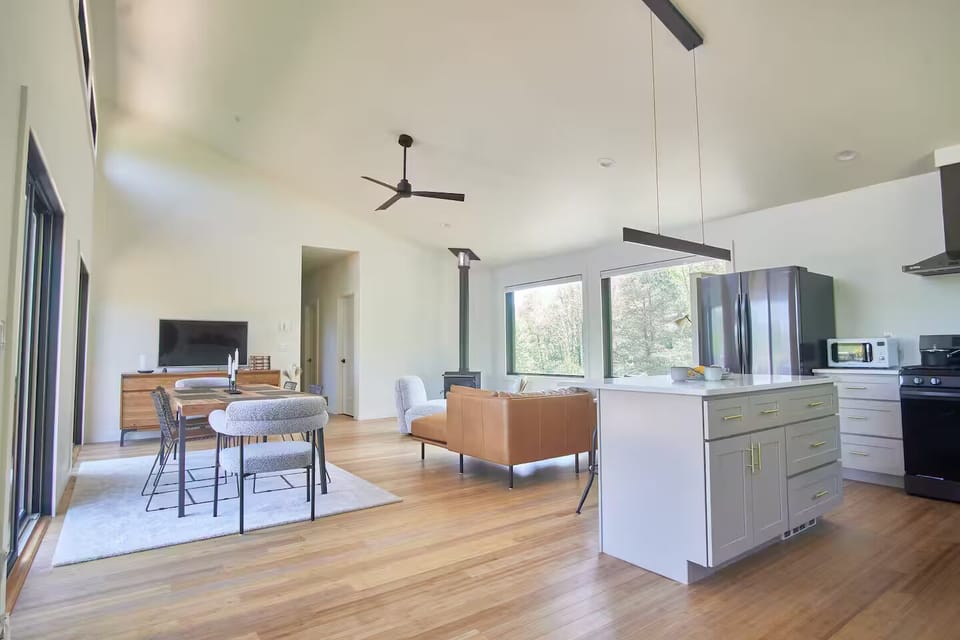 Looking from the main entrance through the living area and the kitchen.