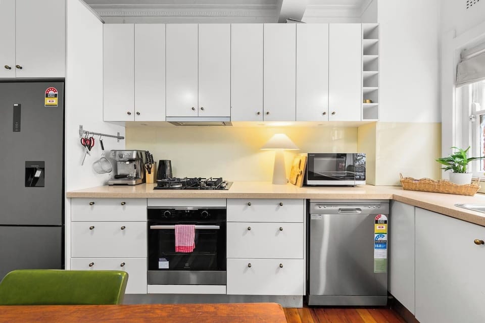 Whip up delicious meals in the modern kitchen with a gas cooktop, oven and dishwasher.