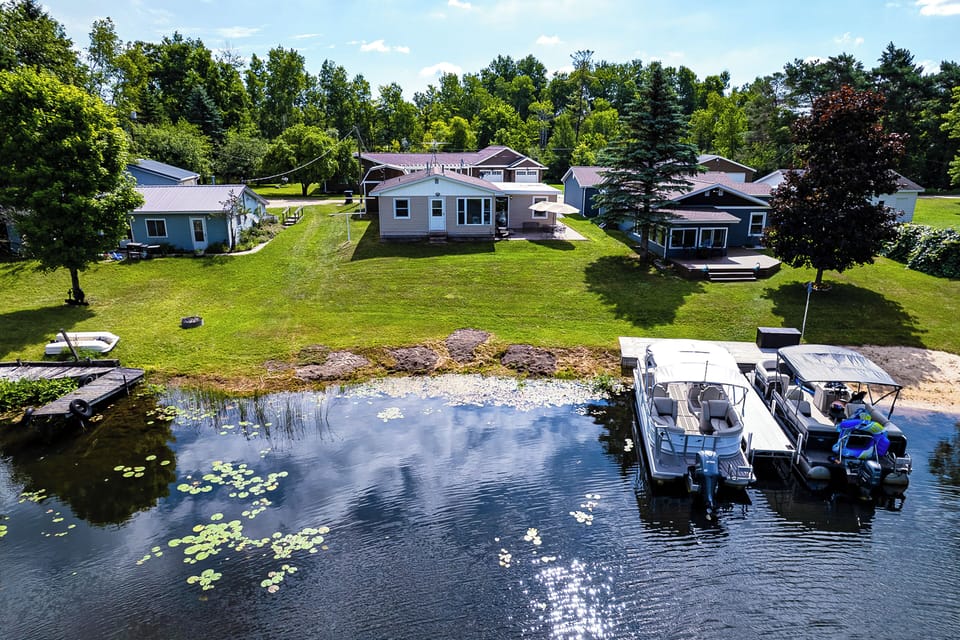 Property Exterior | Shared Dock | Private Patio w/ Dining Table | Spacious Yard