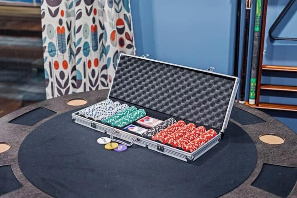 Poker set ready for game night—complete with chips, cards, and table.