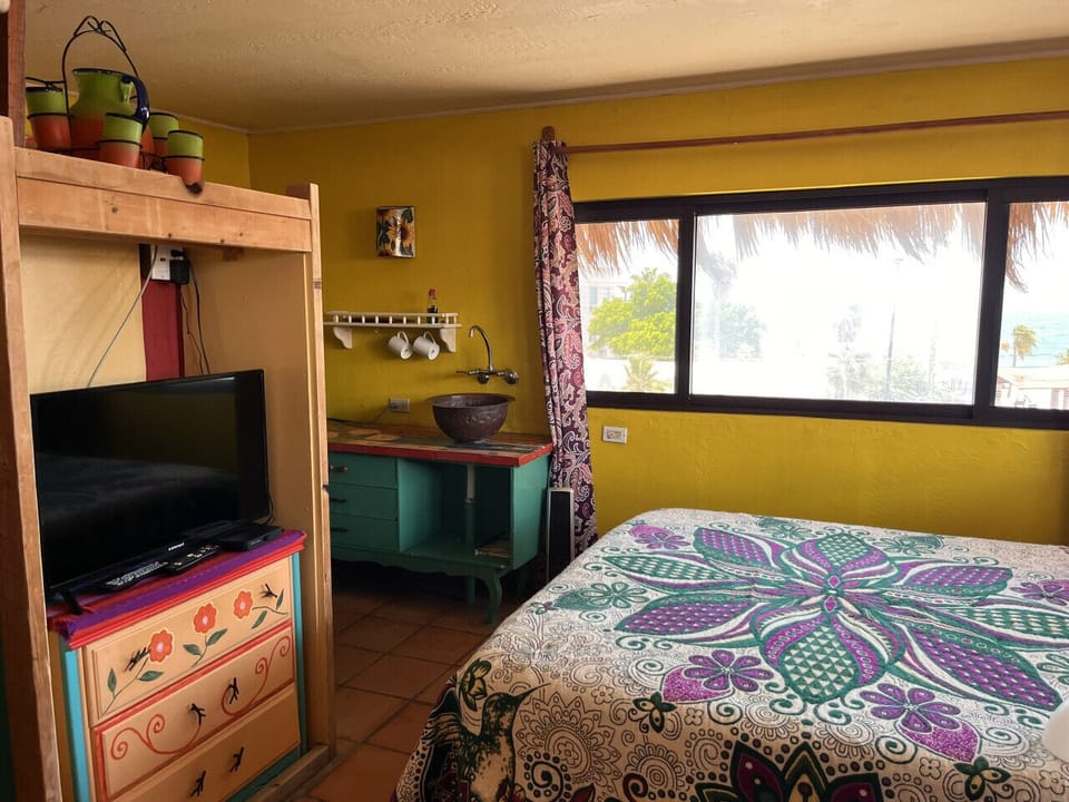 Room 5 — warm, charming, inviting, private, and exclusive, with breathtaking Ocean views. Truly special!