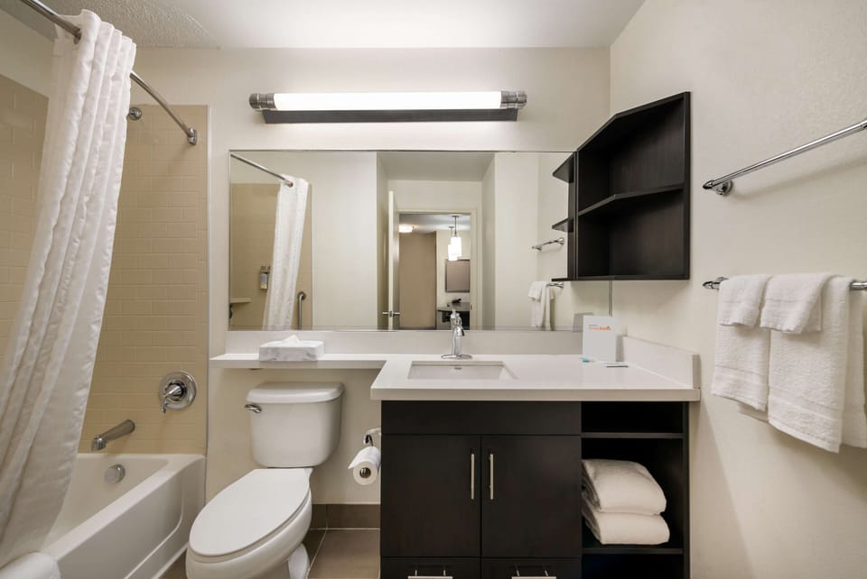 Start your day with fresh towels and a clean, modern vanity.