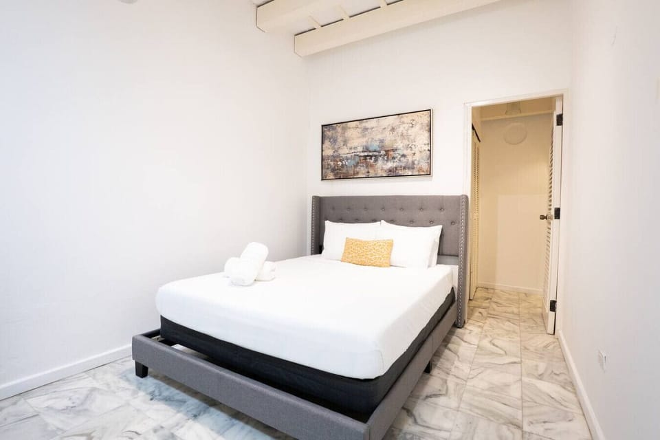 Cozy bedroom with a comfortable bed and clean, modern design.