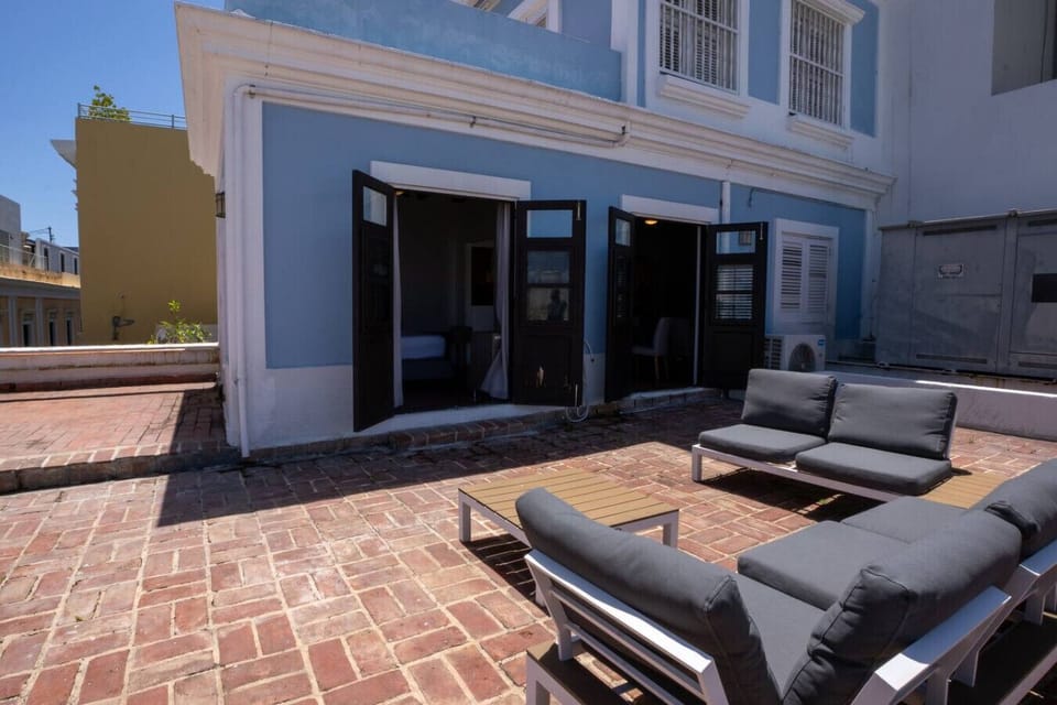 Private brick patio with outdoor seating and lounge area