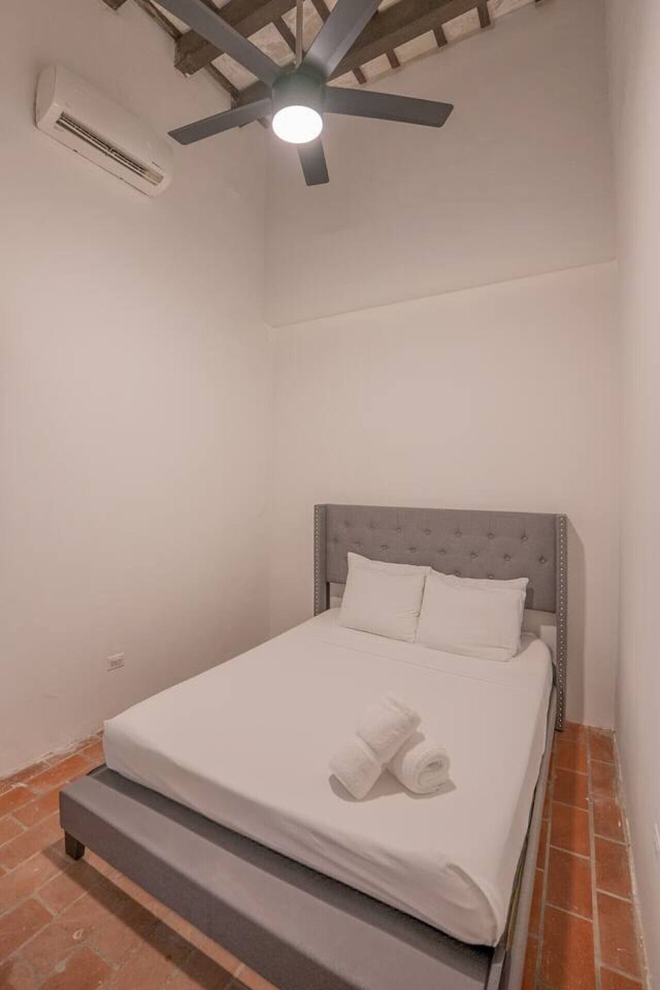 Simple double bedroom with cozy bed and clean design