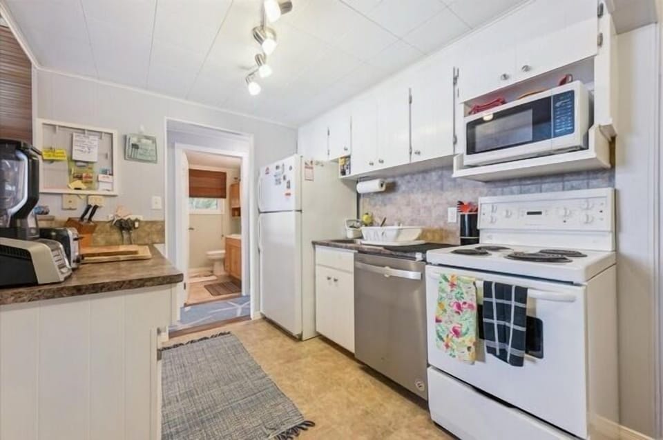 Charming, functional kitchen with ample storage, updated appliances, and a cozy cottage feel — ready for home-cooked meals.