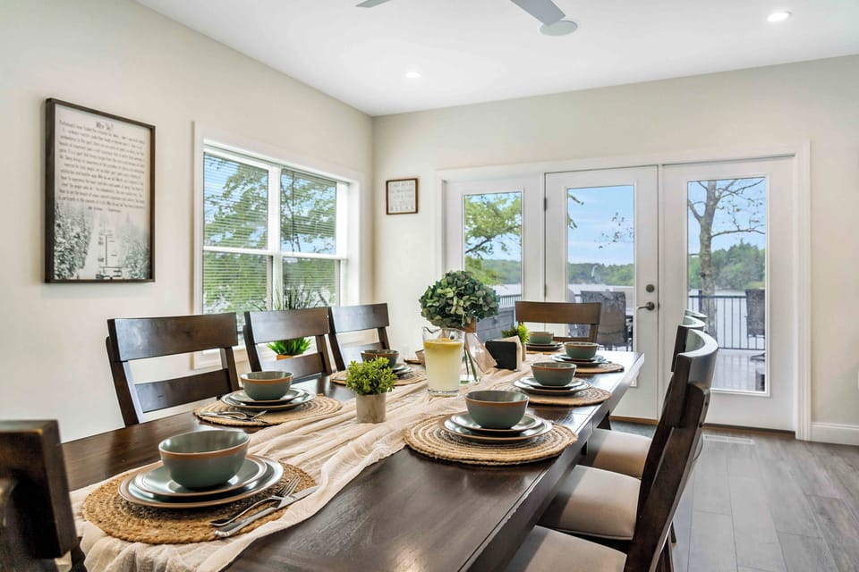 Share meals and make memories around the spacious dining table with beautiful lake views.