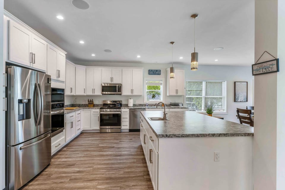 Features two expansive islands — one designed for cooking and prep, and another perfect for dining and gathering — giving everyone plenty of room to spread out