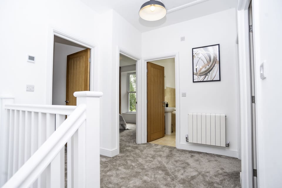 Bright Open Landing - Spacious area leading to private bathrooms and en-suite bedrooms for added comfort and privacy