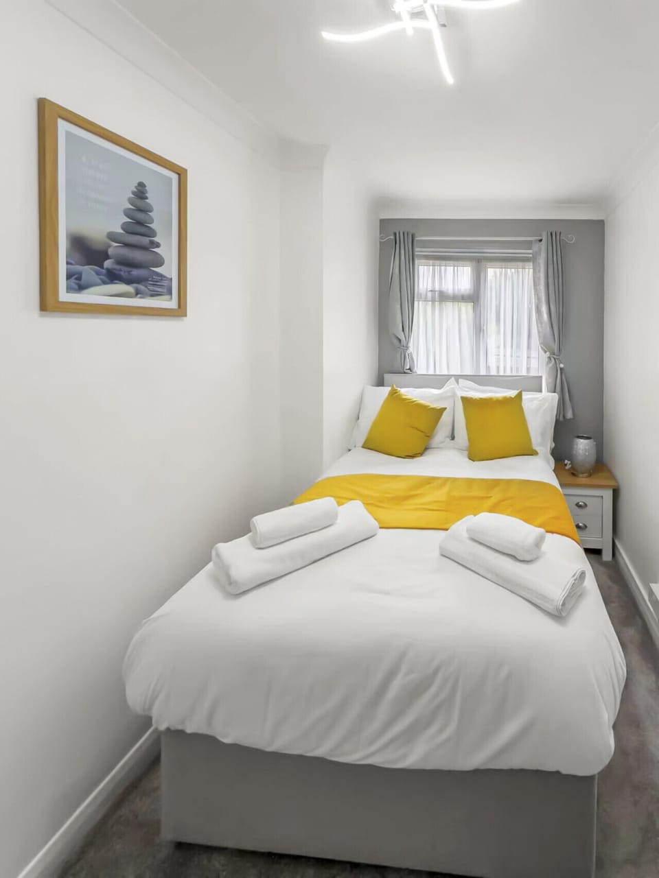 Second bedroom with bright double bed setup