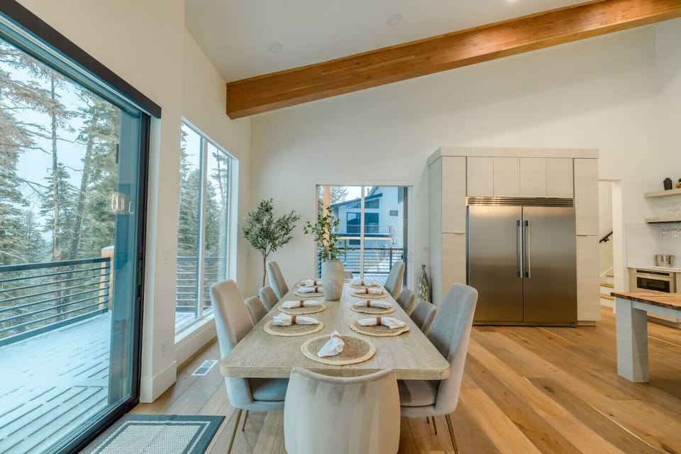 [Top Floor] Our awesome dining room table, with our large fridge and freezer behind it