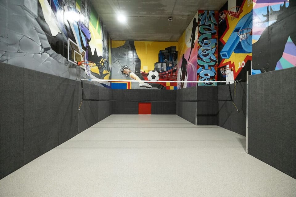 [Middle Floor] Have a ball in our outstanding gym/sports court! With custom murals, basketball hoops, volleyball net, and more!